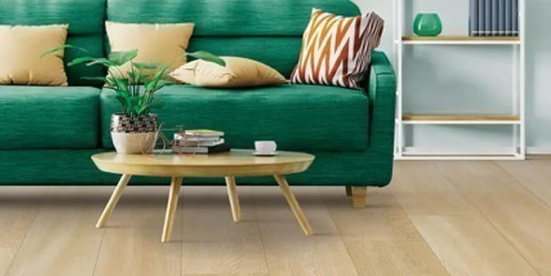 Green sofa on Laminate | DeHaan Tile & Floor Covering